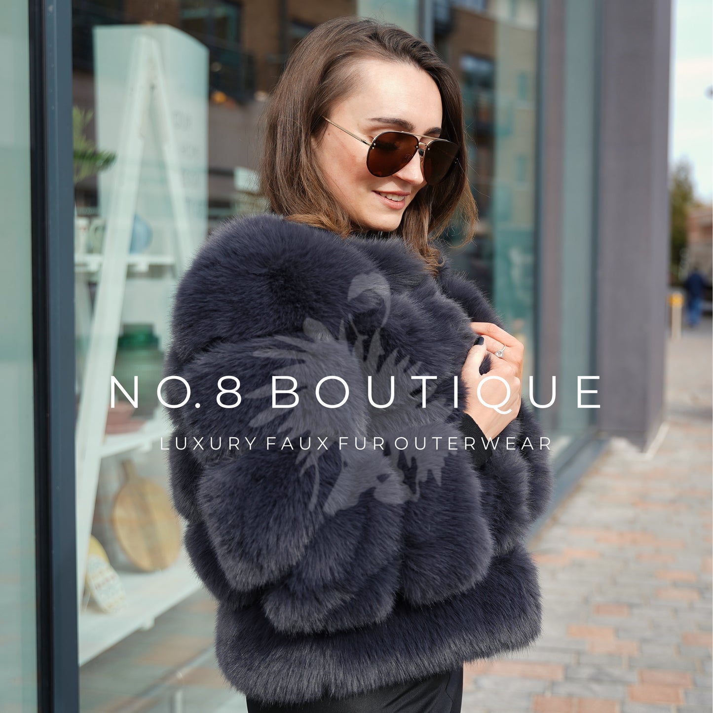 Casual yet elegant charcoal grey faux fur jacket with five rows