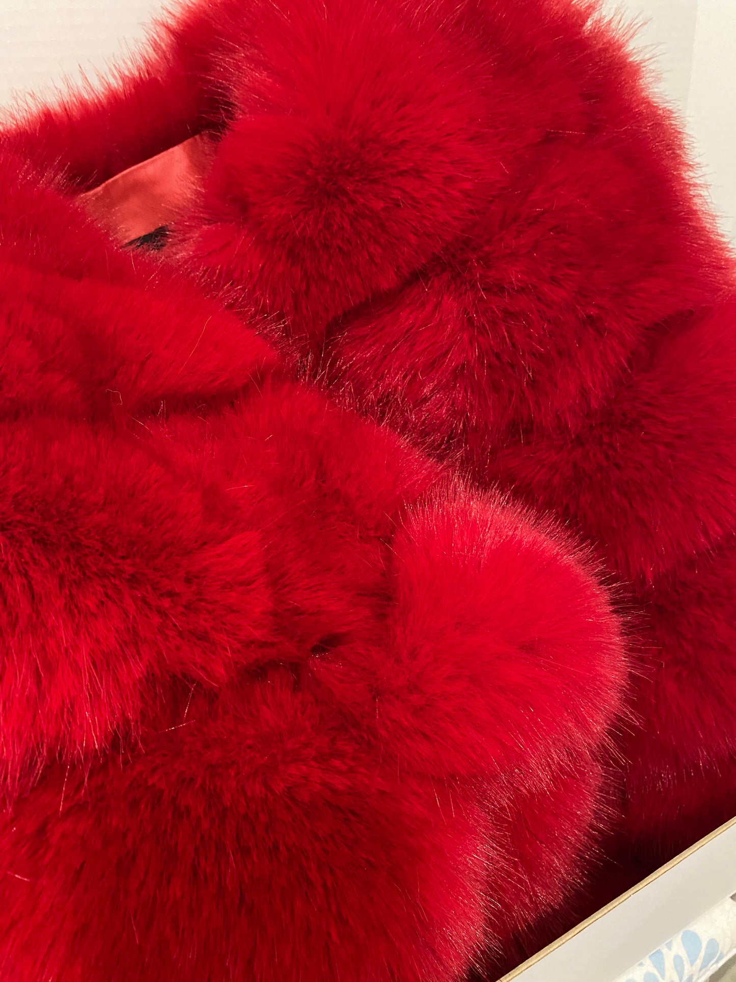 Sophisticated red faux fur jacket with five plush rows
