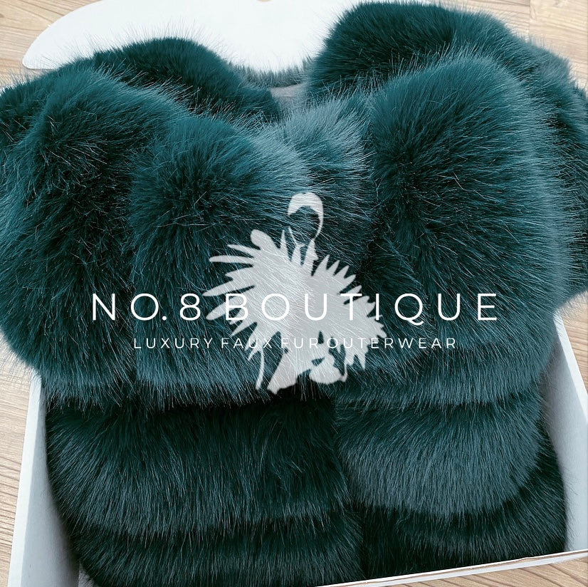 Stylish emerald green faux fur jacket with five plush rows