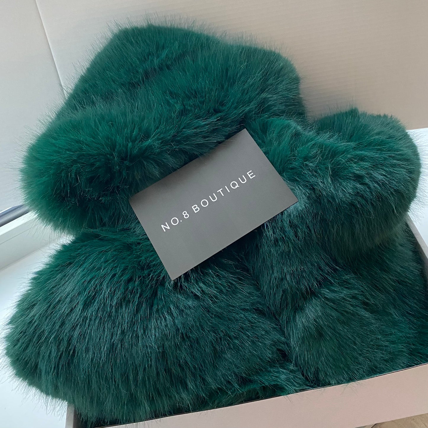 Trendy HD faux fur cropped jacket featuring a hood