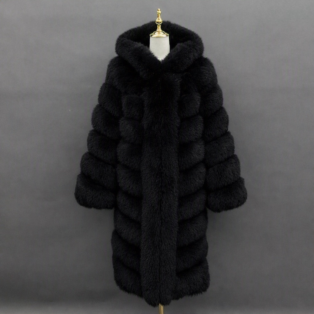 A long black fur coat with horizontal channel tufting and a large plush collar, displayed on a mannequin torso against a dark gray studio background.