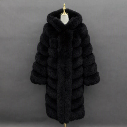 A long black fur coat with horizontal channel tufting and a large plush collar, displayed on a mannequin torso against a dark gray studio background.