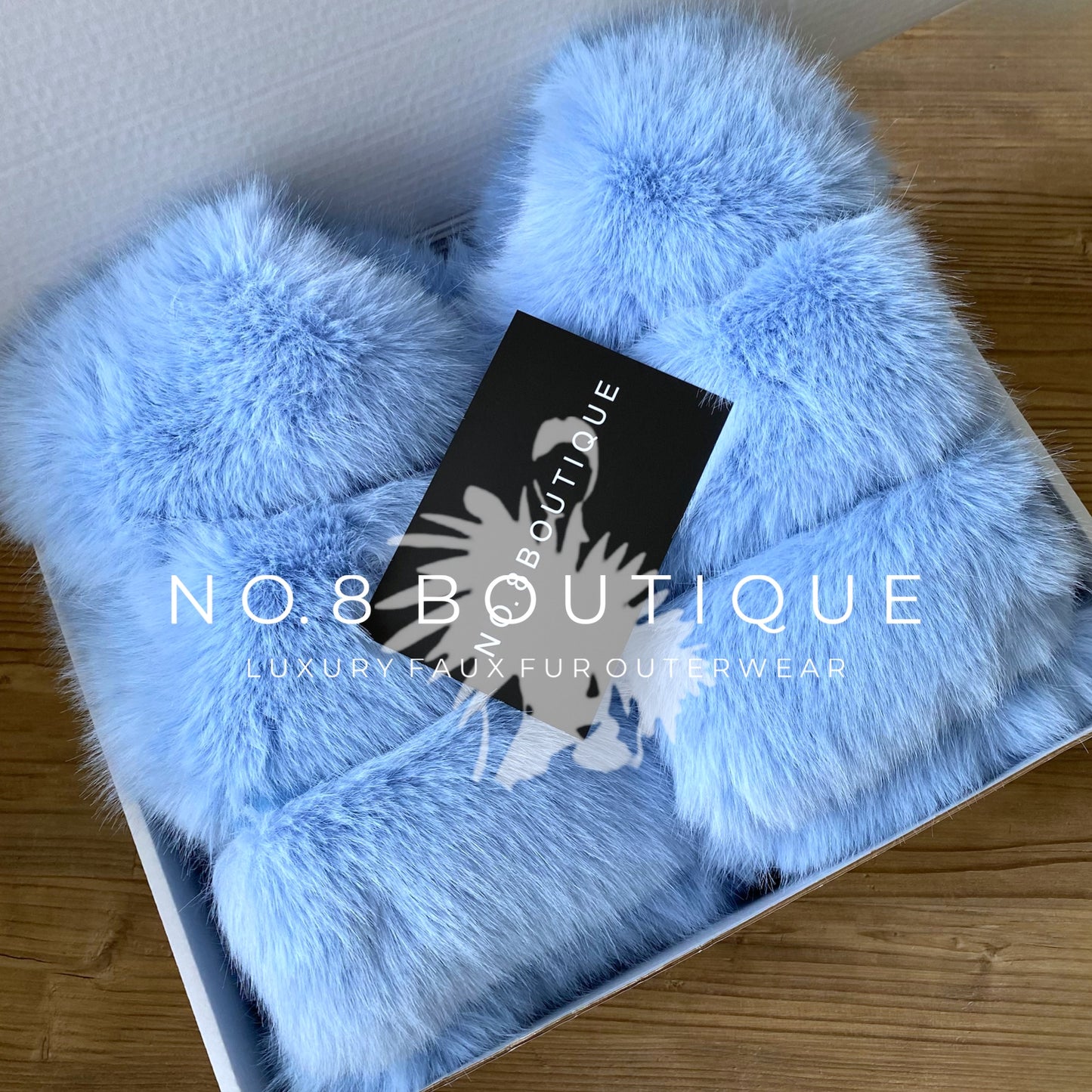 Baby blue faux fur jacket with 5 horizontal rows