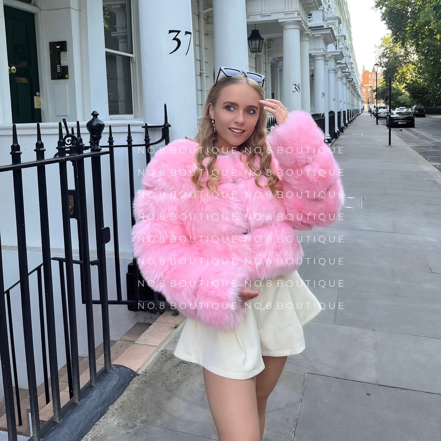 Chic cropped pink faux fur jacket with three horizontal rows