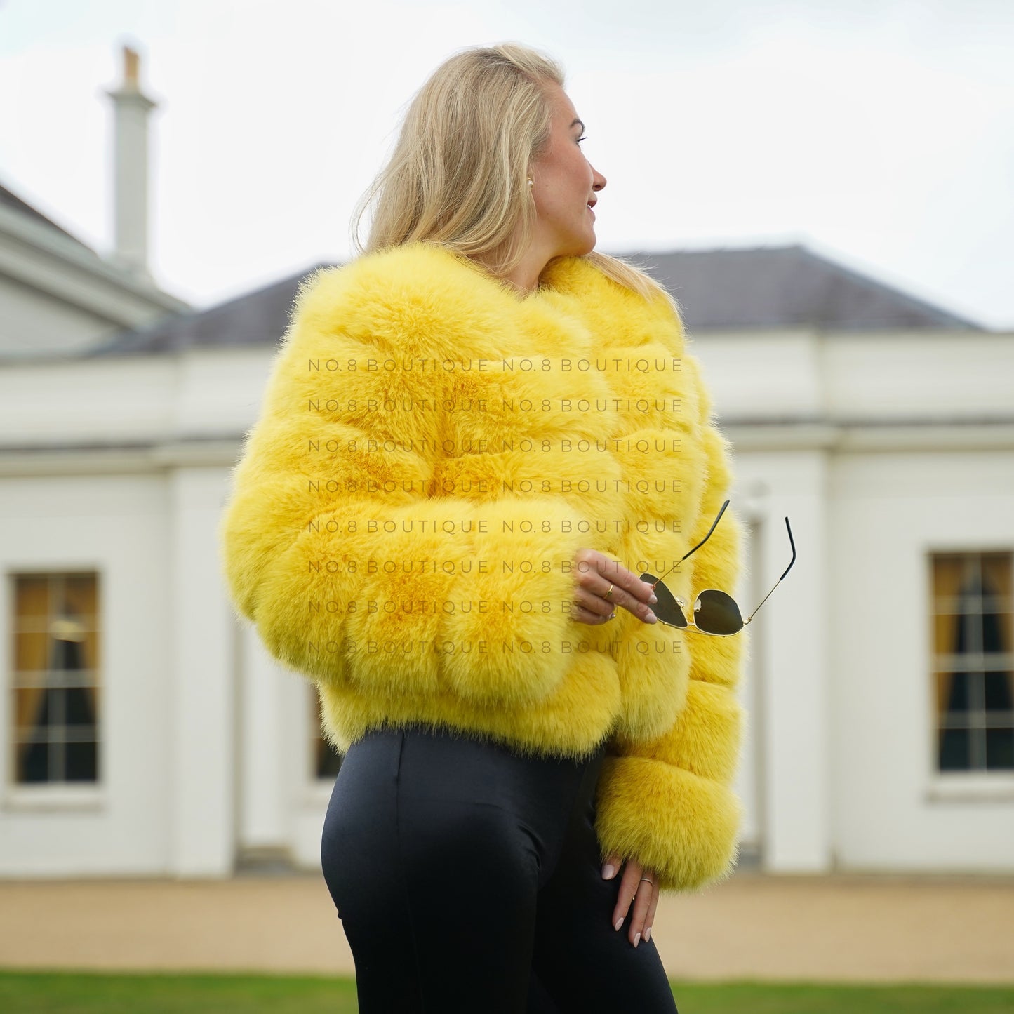 Chic yellow faux fur jacket with a plush texture