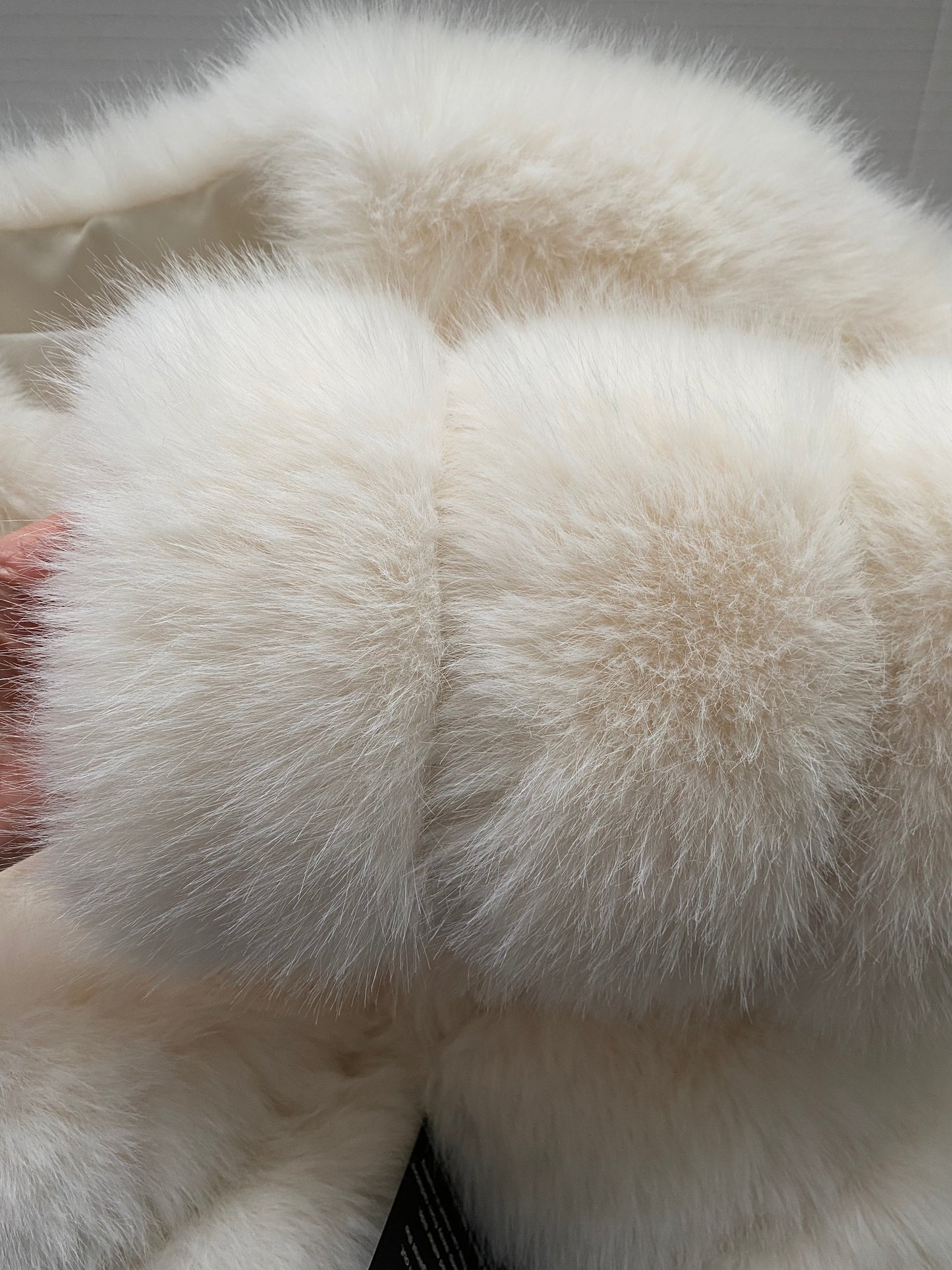 High-fashion white faux fur coat with 7 horizontal rows