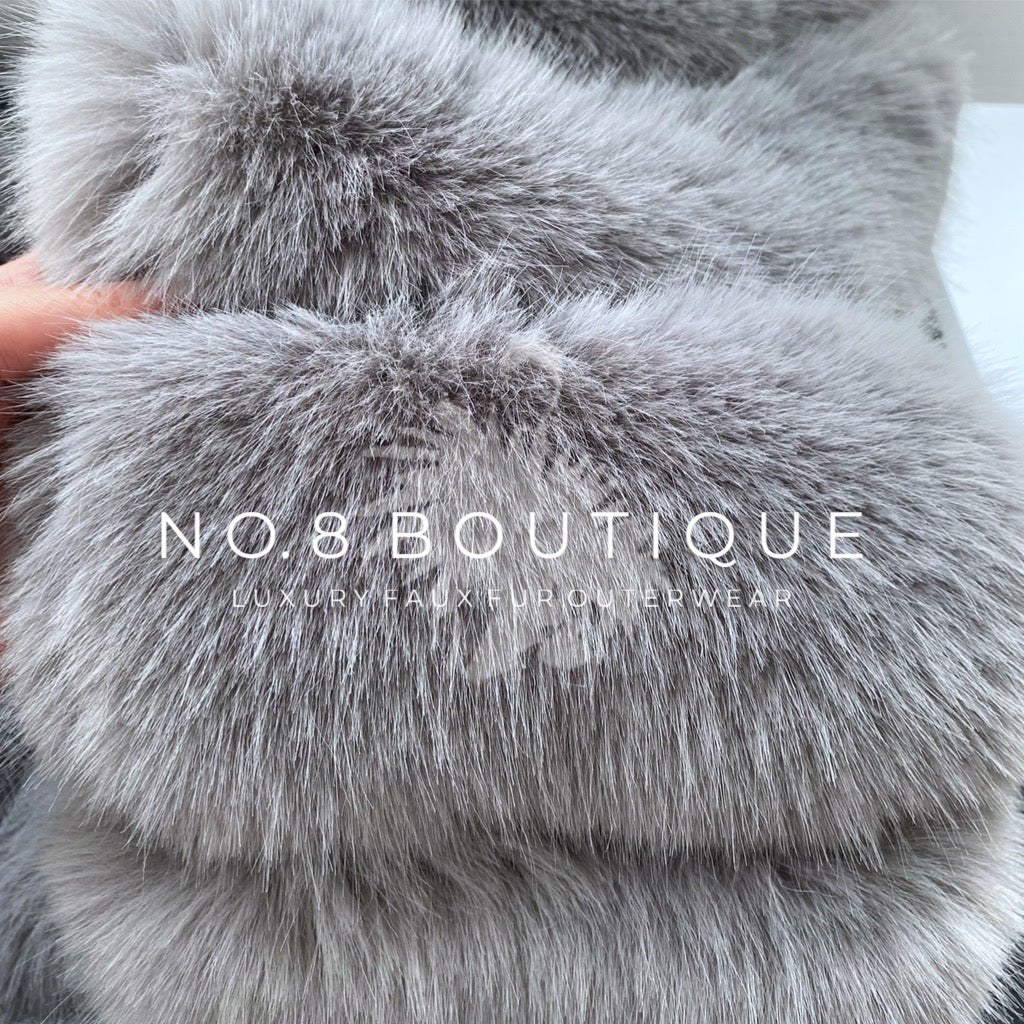 light grey faux fur jacket featuring 5 structured rows