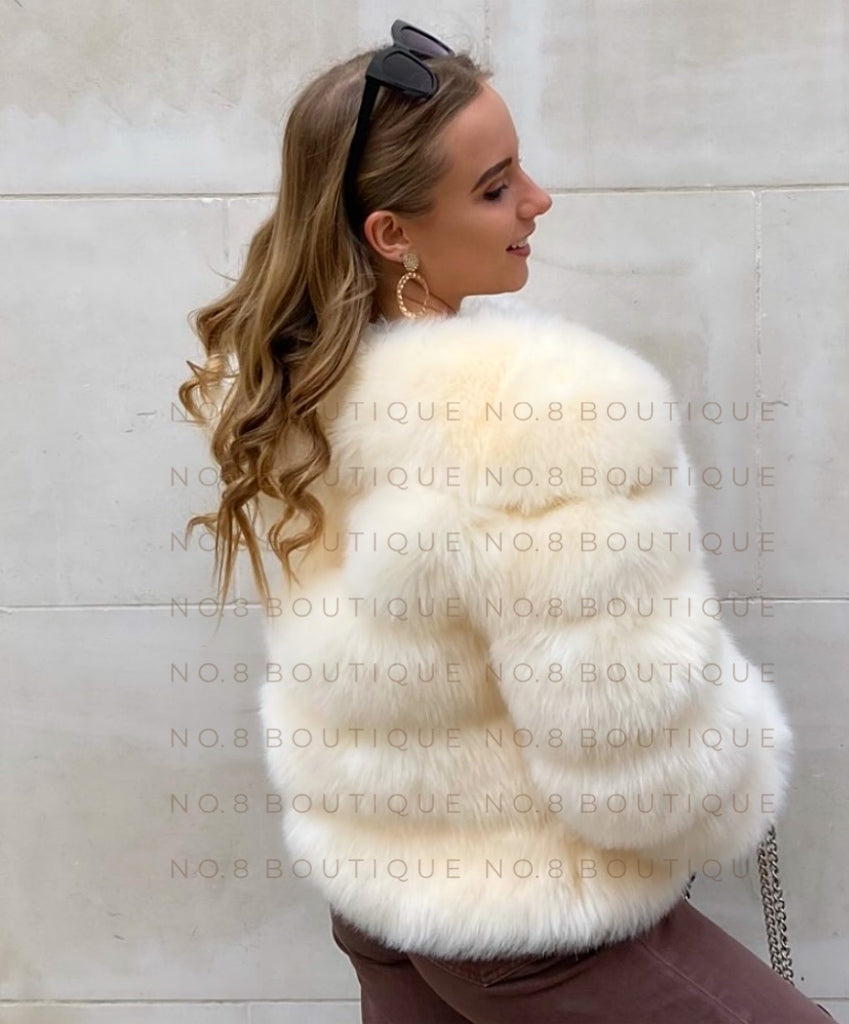 Luxurious cream faux fur jacket with five structured rows