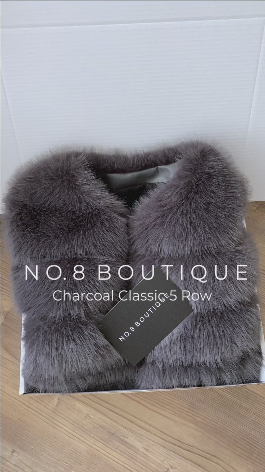 Sophisticated charcoal grey faux fur jacket with five horizontal rows