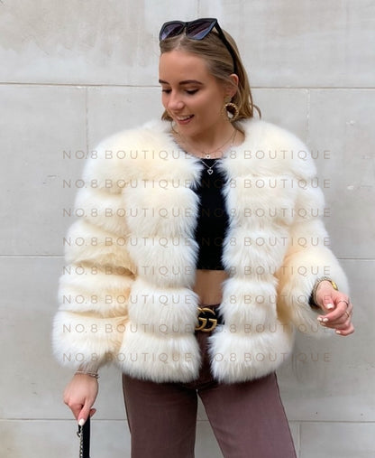 Sophisticated cream faux fur jacket featuring 5 plush rows