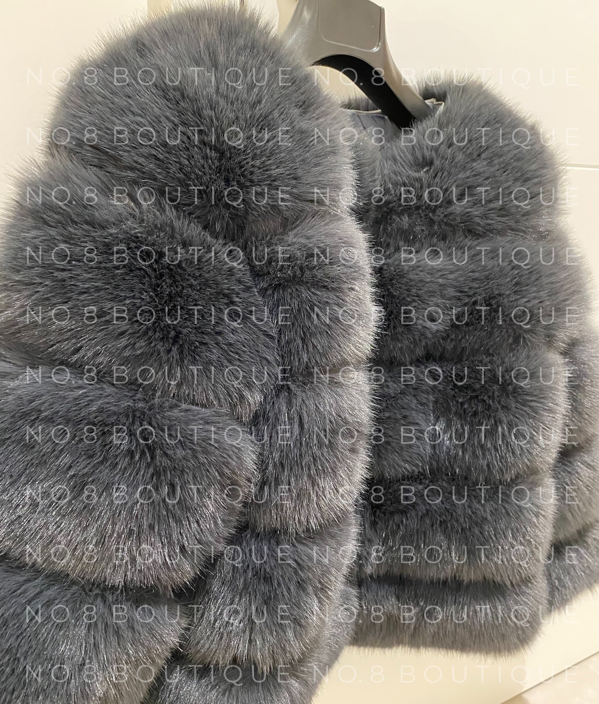 Stylish charcoal grey faux fur jacket with horizontal rows