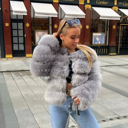 Stylish light grey jacket in faux fur with five elegant rows