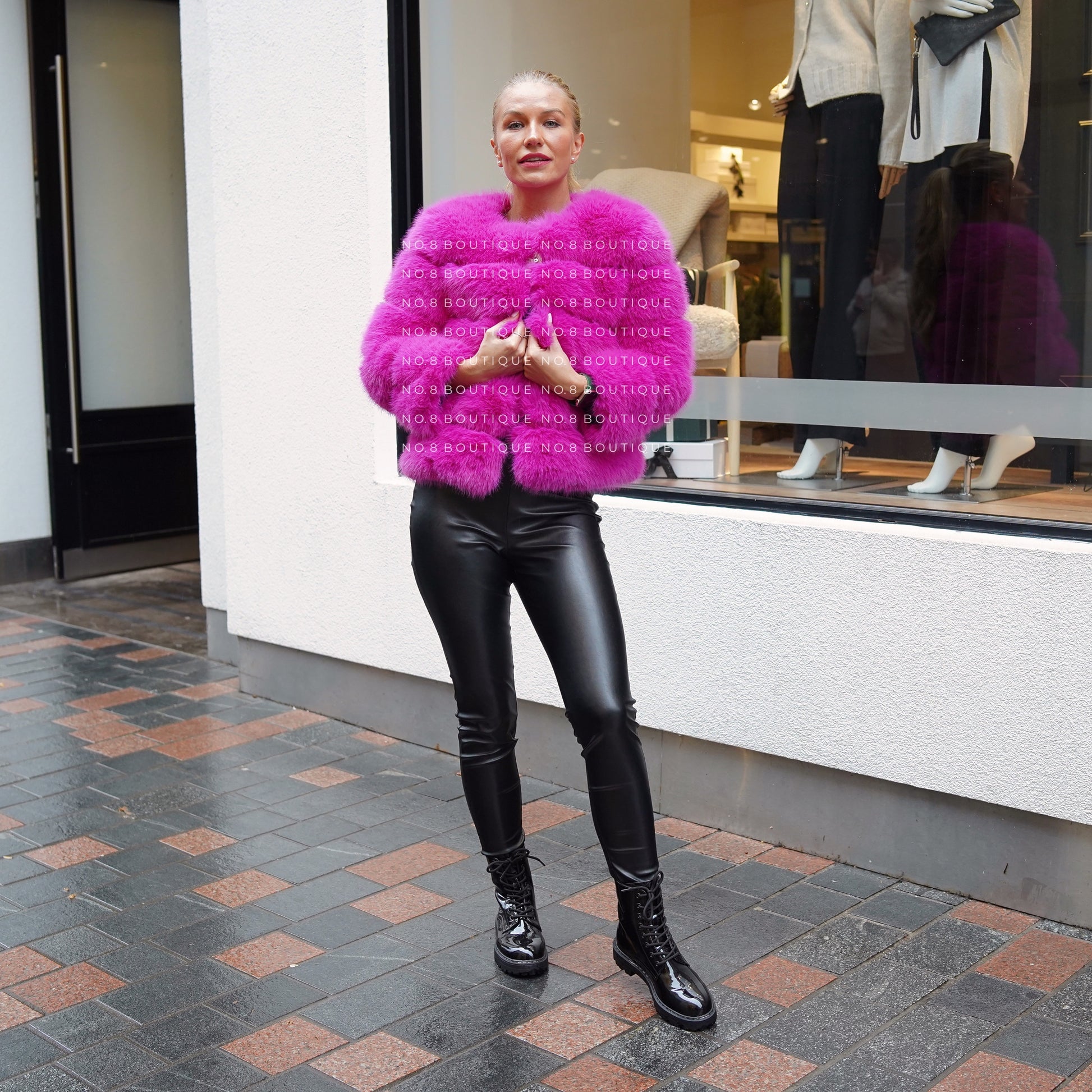 Stylish magenta pink jacket in faux fur with five elegant rows