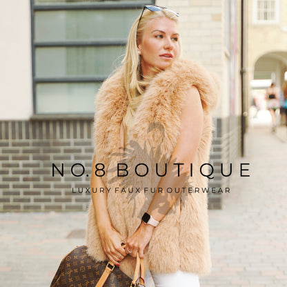 Vienna hooded gilet featuring straight rows of faux fur