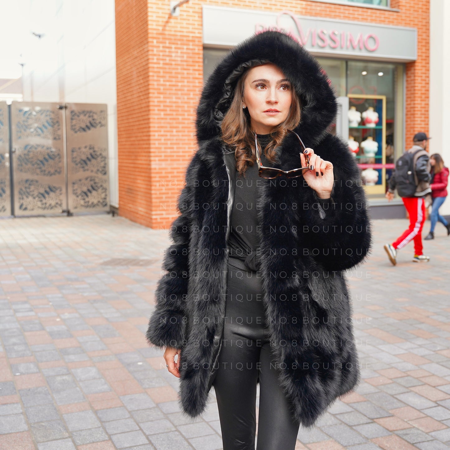 Contemporary long faux fur coat with hood