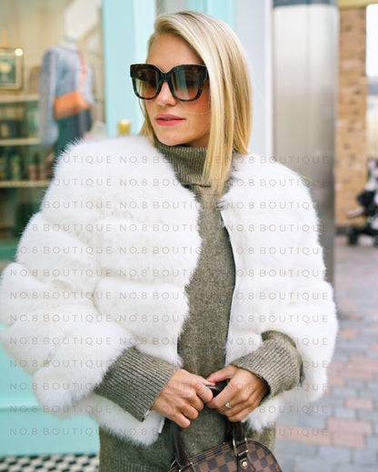 Contemporary white faux fur jacket with five plush rows