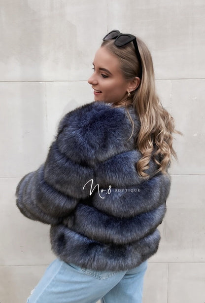 Luxurious blue grey faux fur jacket structured in five rows