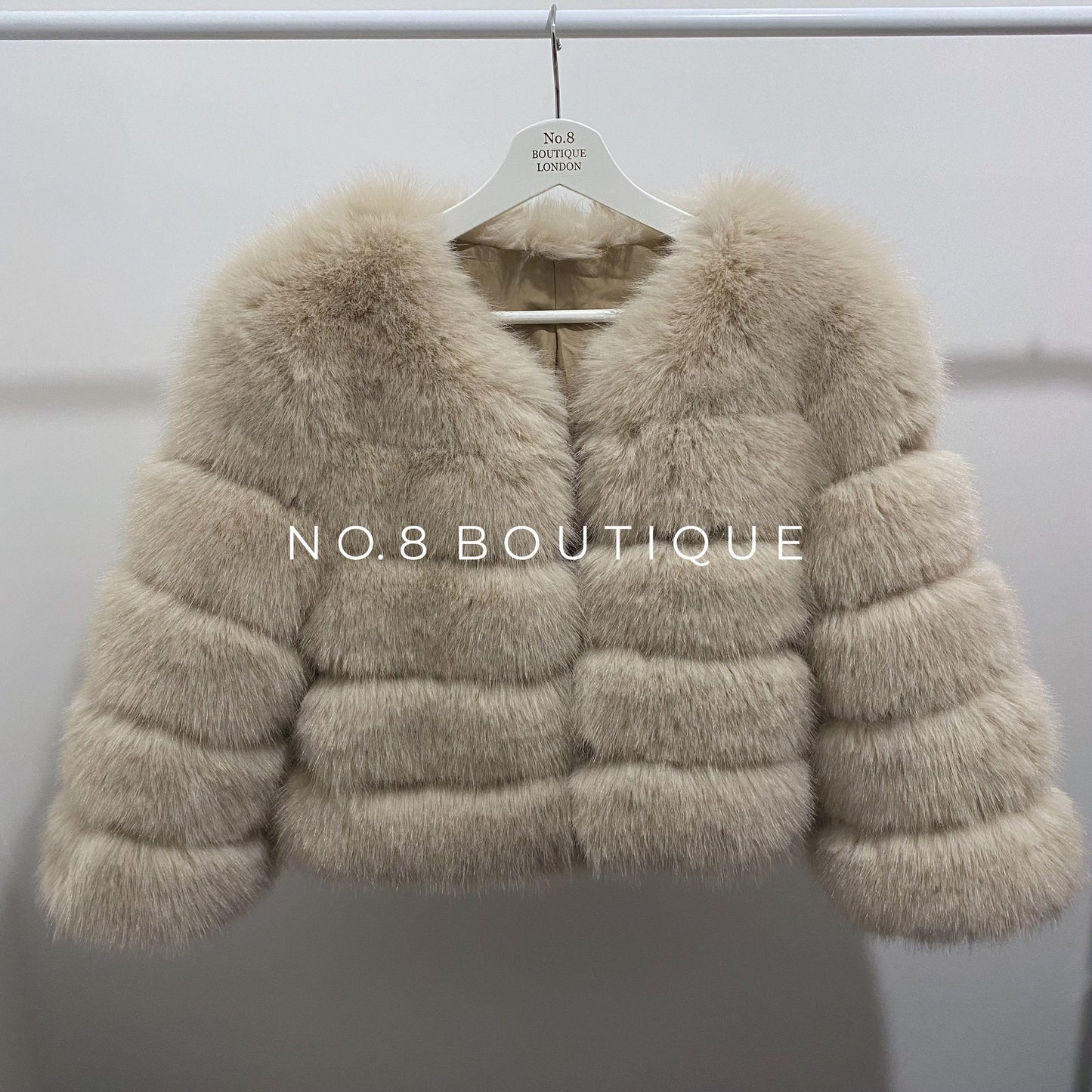 Sophisticated beige faux fur jacket with 5 rows