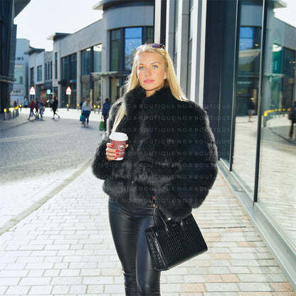 Sophisticated Chelsea black faux fur jacket with five rows and collar