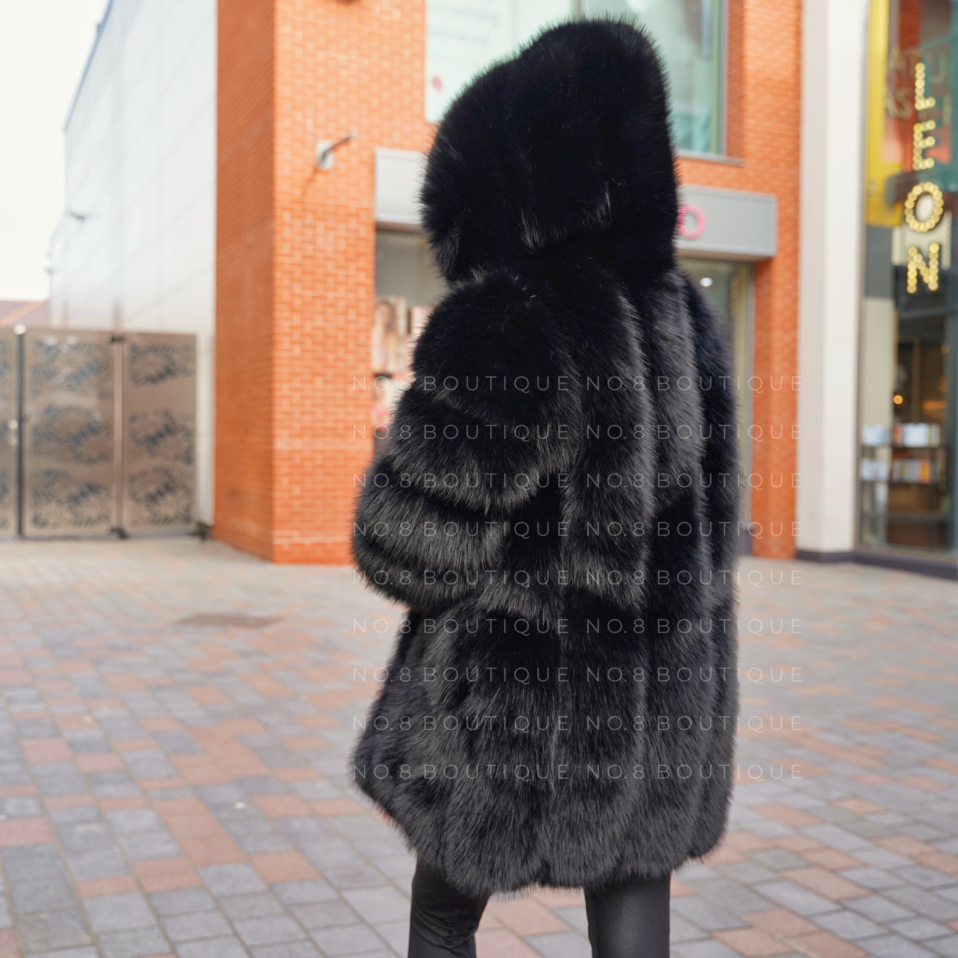 Sophisticated Vienna hooded faux fur long coat for elegant layering