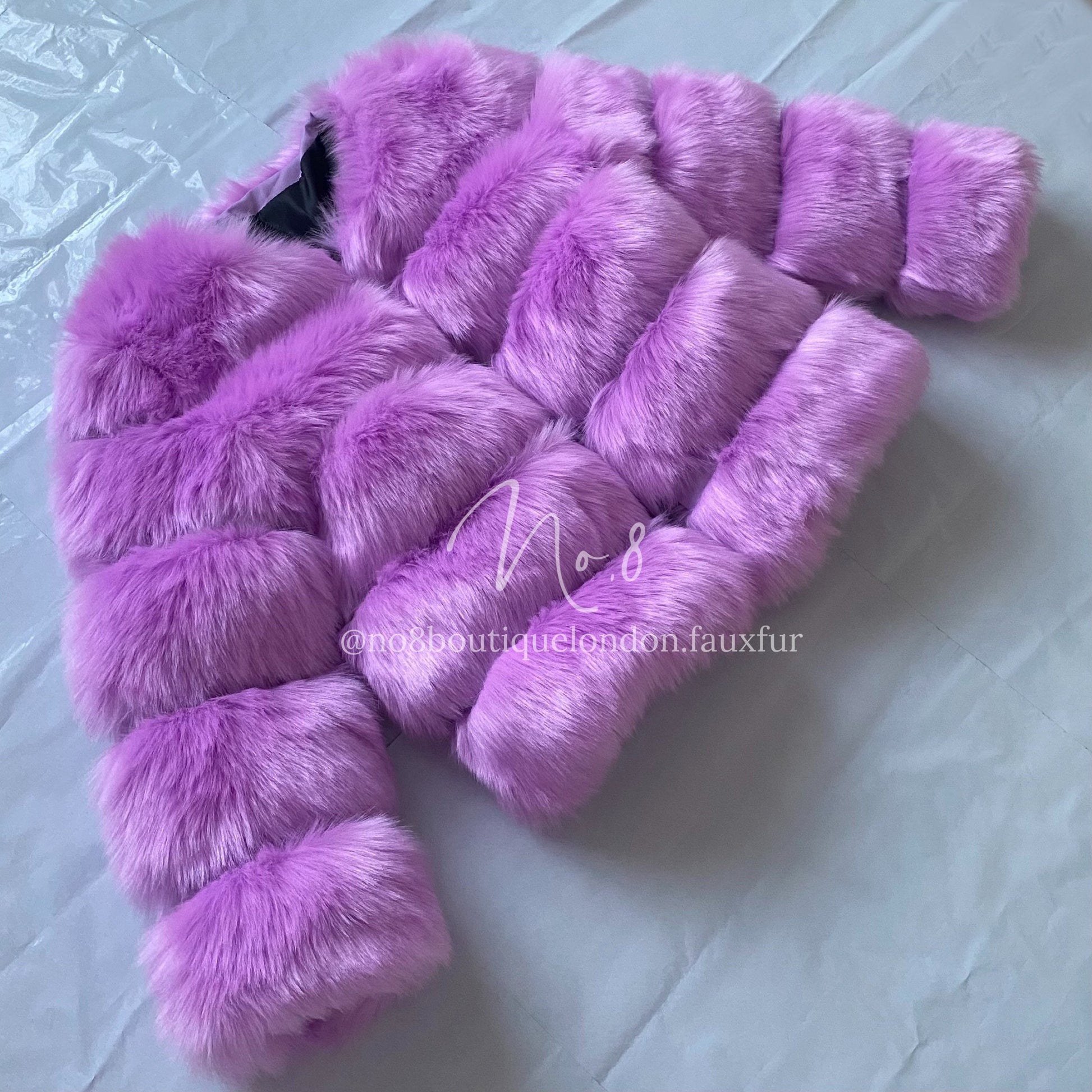 Stylish violet jacket in faux fur with five elegant rows